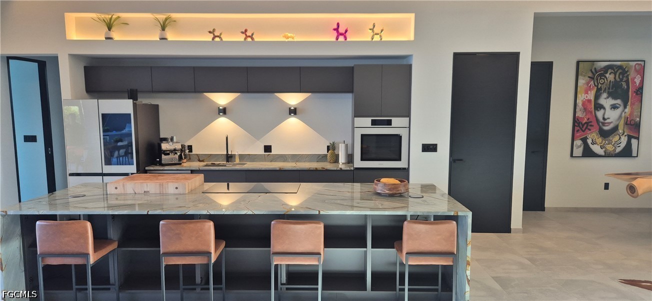 14 Burnt Store Road Cape Coral, FL 33991 - Photo 7 of 30 a kitchen with a table and chairs