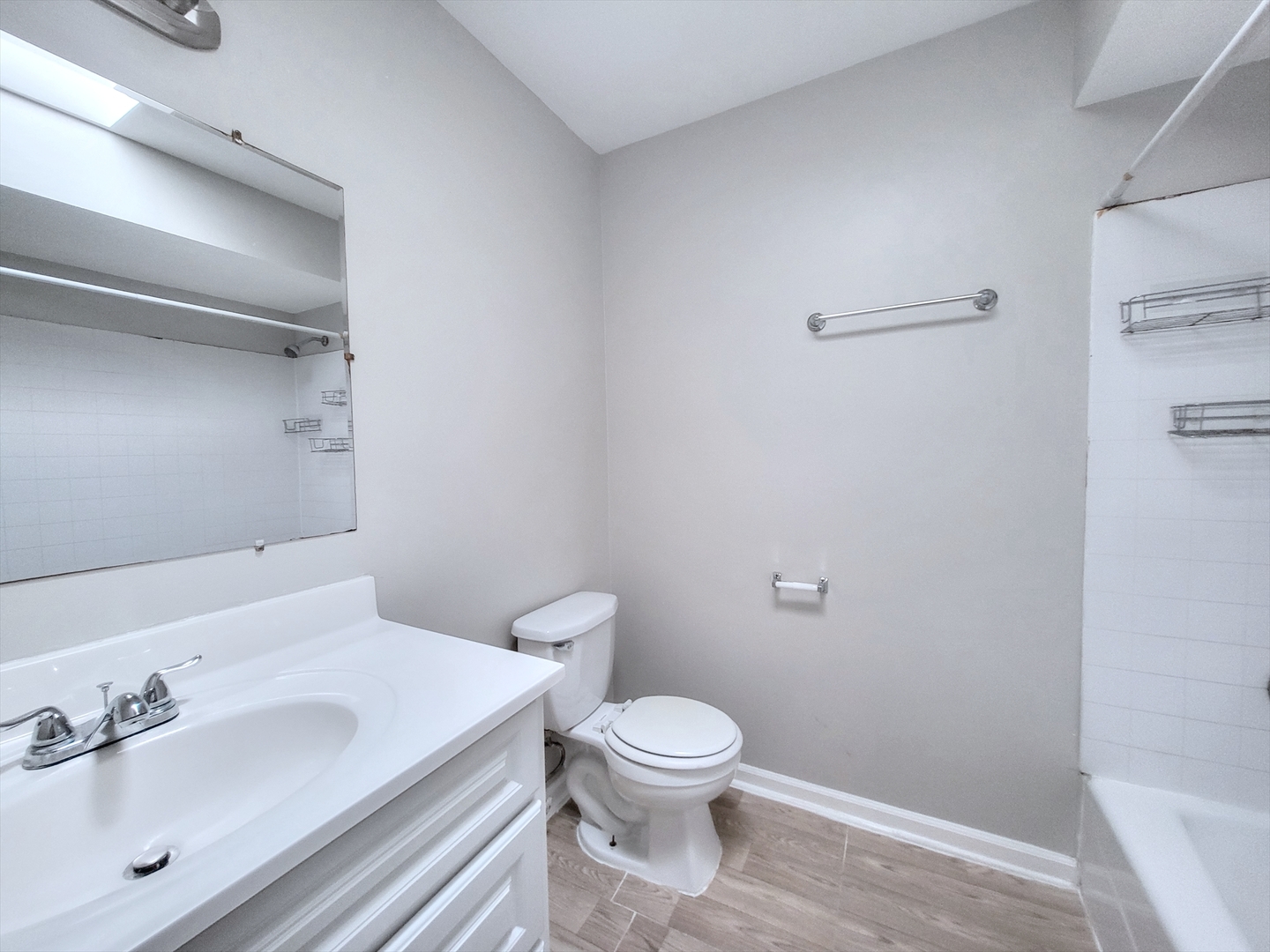 14326 Irving Avenue Dolton, IL 60419 - Photo 23 of 31 a bathroom with a sink a toilet and a mirror