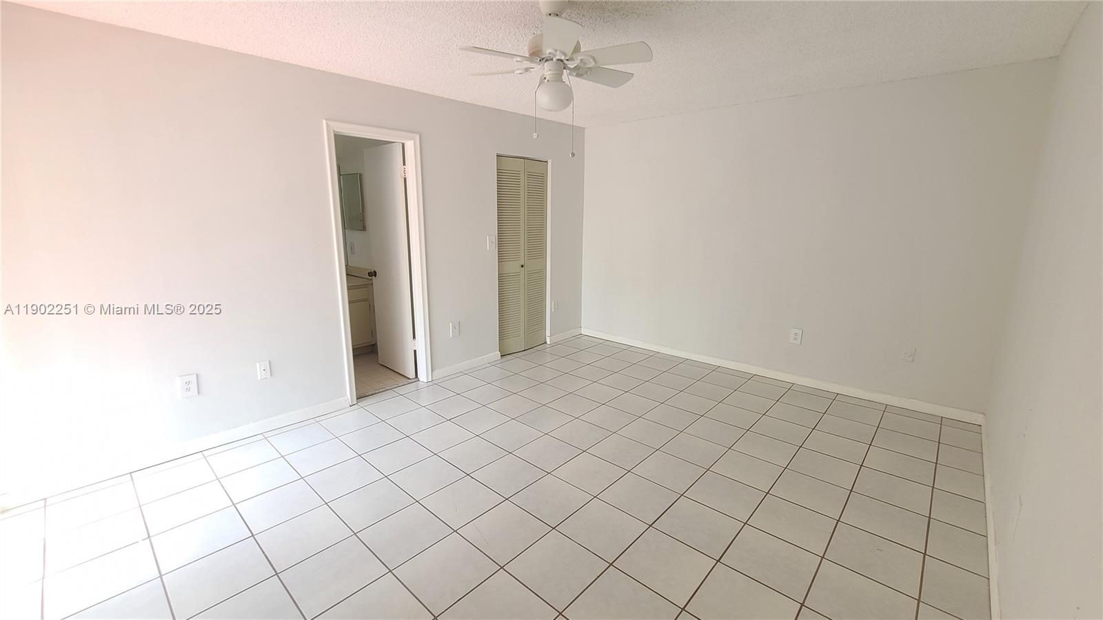 13458 Southwest 62nd Street, Unit Q105 Miami, FL 33183 - Photo 13 of 16 a view of an empty room