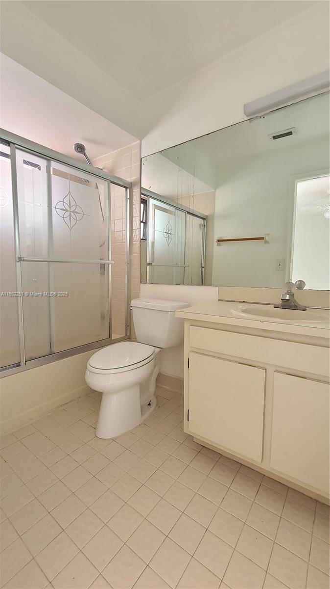 13458 Southwest 62nd Street, Unit Q105 Miami, FL 33183 - Photo 16 of 16 a bathroom with a sink toilet and shower