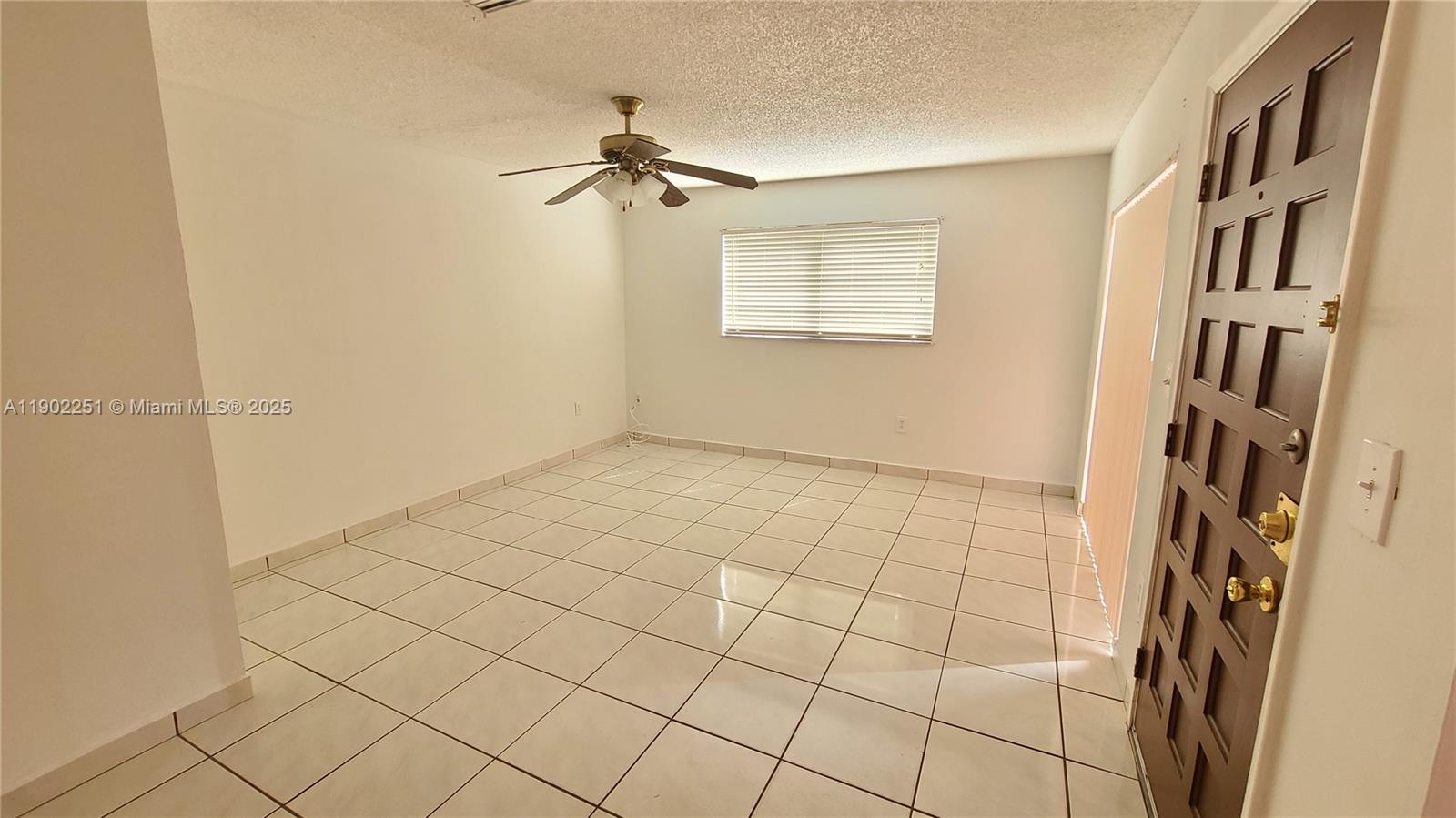 13458 Southwest 62nd Street, Unit Q105 Miami, FL 33183 - Photo 3 of 16 a view of an empty room