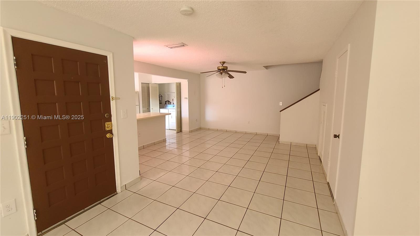 13458 Southwest 62nd Street, Unit Q105 Miami, FL 33183 - Photo 4 of 16 a view of an empty room