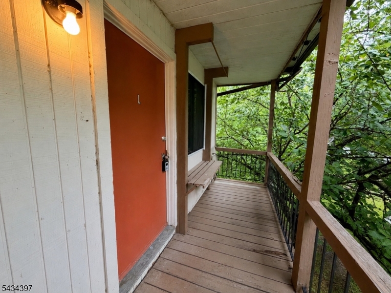 207 Old Chimney Ridge Road, Unit L Montague, NJ 07827 - Photo 1 of 14 a view of balcony with wooden floor