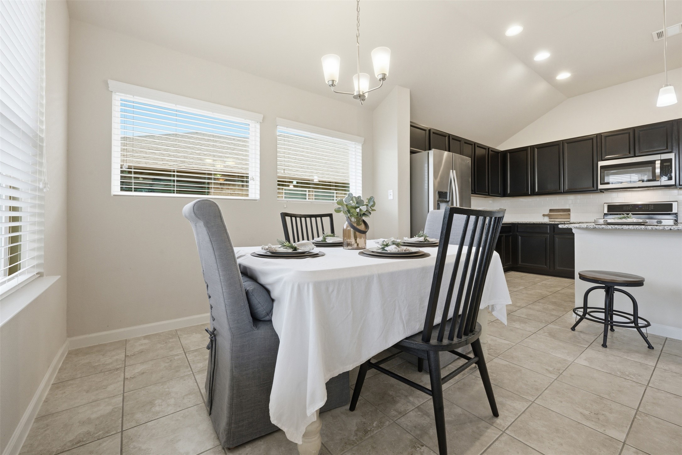 276 Gunnison Way Kyle, TX 78640 - Photo 6 of 28 a view of a dining room with furniture