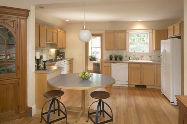 67 Ravine Road Medford, MA 02155 - Photo 6 of 9 a kitchen with microwave a refrigerator and chairs