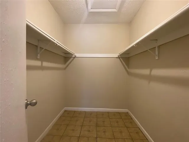a view of an empty walk in closet