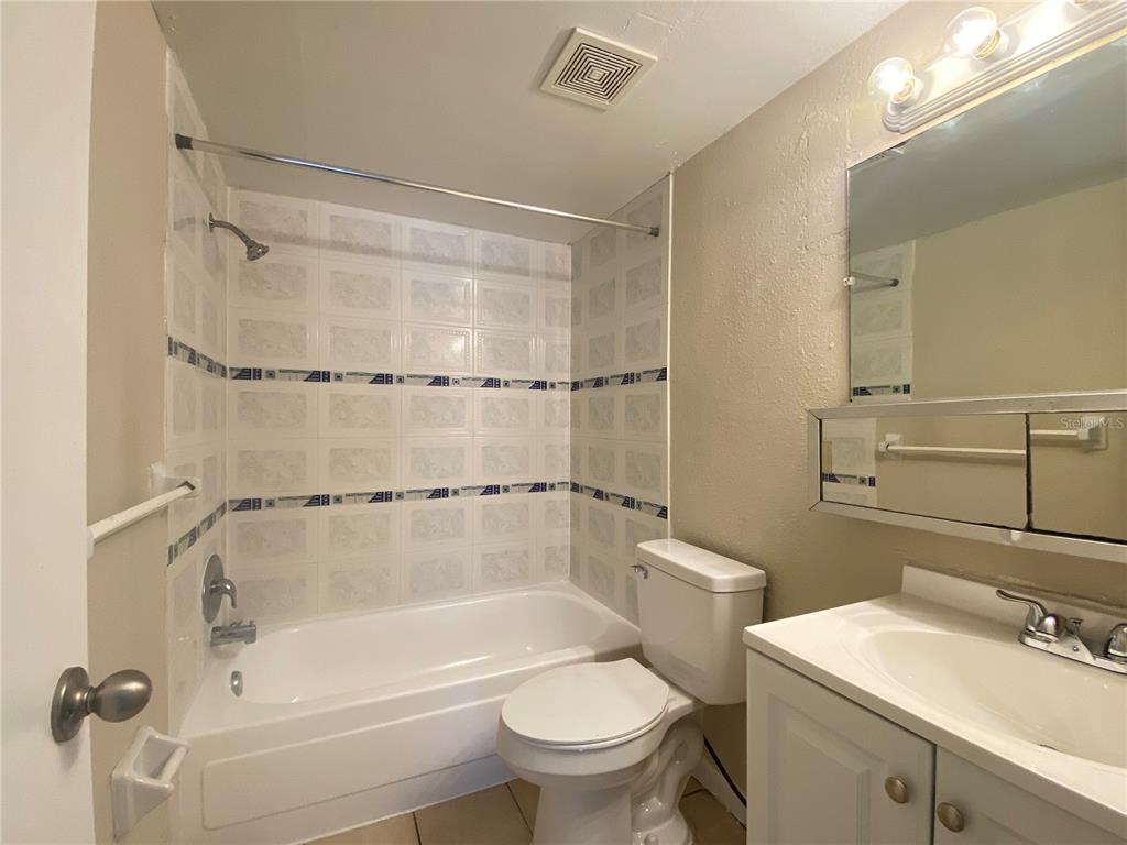 5115 Curry Ford Road, Unit 3 Orlando, FL 32812 - Photo 12 of 12 a bathroom with a sink mirror toilet and bathtub