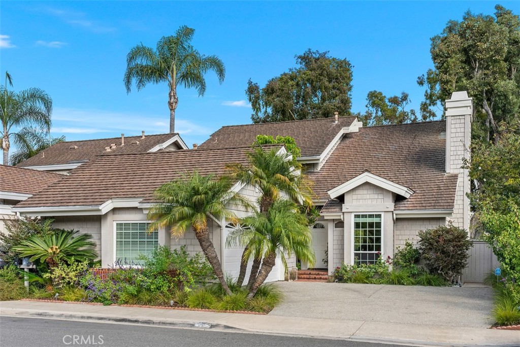 26 Southern Wood Irvine, CA 92603 - Photo 1 of 31 front view of a house with a yard and palm trees