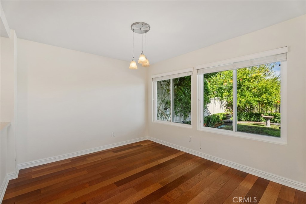 26 Southern Wood Irvine, CA 92603 - Photo 13 of 31 a view of an empty room with wooden floor and a window