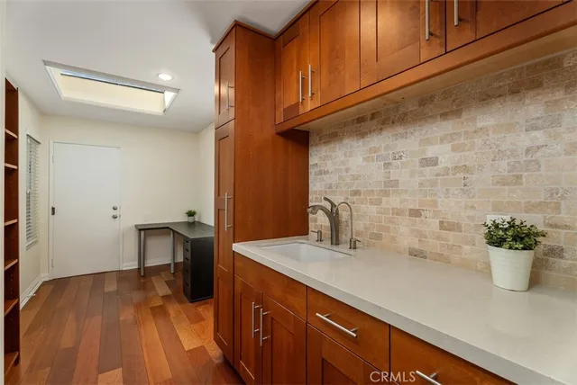 a kitchen with a sink and a microwave