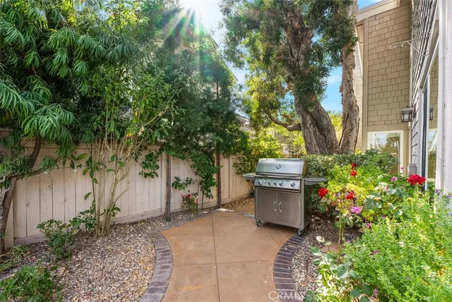 a backyard of a house with a garden and plants