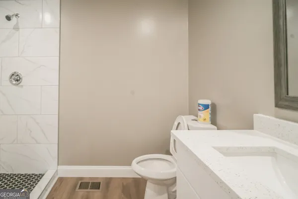 a bathroom with a sink and a toilet