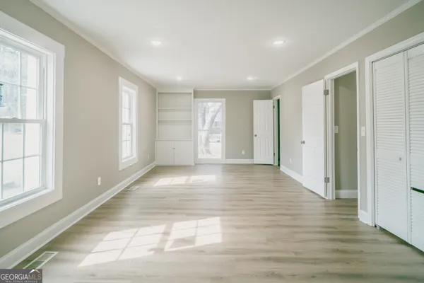 a view of livingroom with an empty space and window