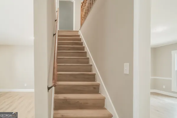 a view of staircase with white walls