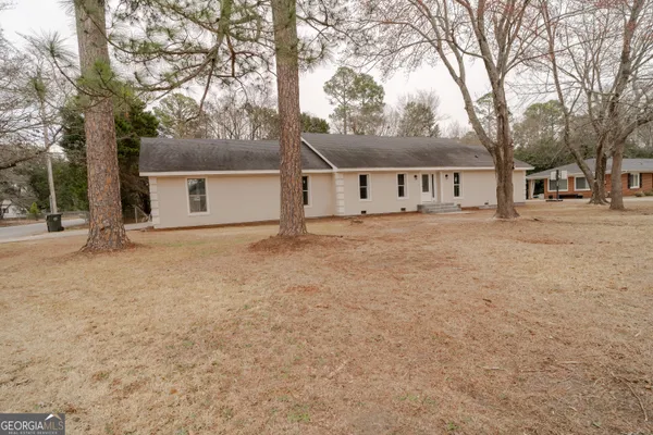 front view of a house with a yard