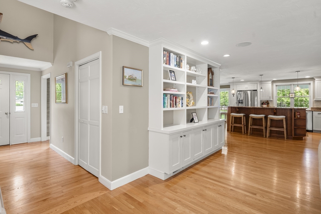 30 Franklin Rodgers Road Hingham, MA 02043 - Photo 11 of 37 a kitchen with stainless steel appliances wooden floors and white cabinets
