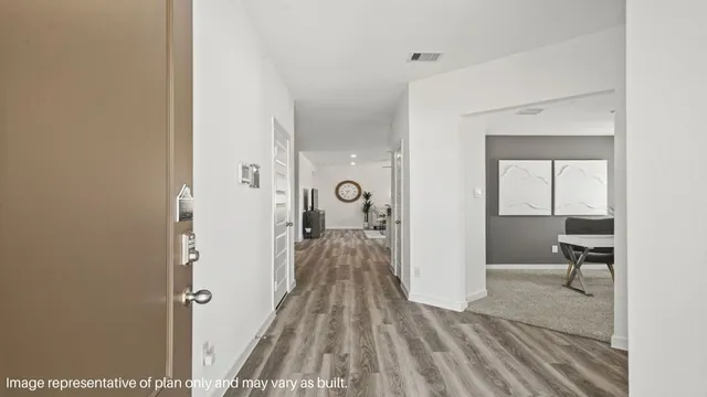 a view of a bedroom from a hallway