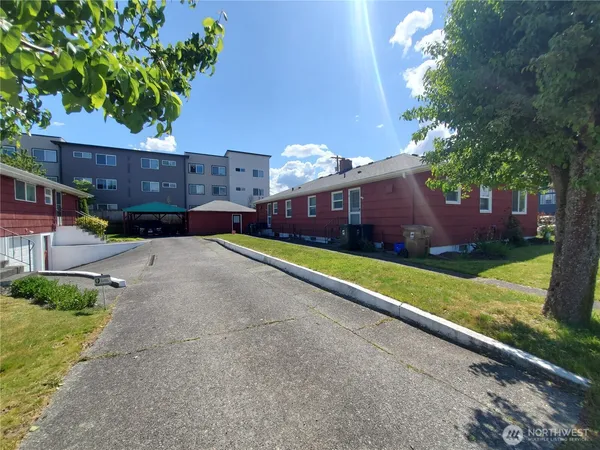 a front view of house with yard and outdoor seating