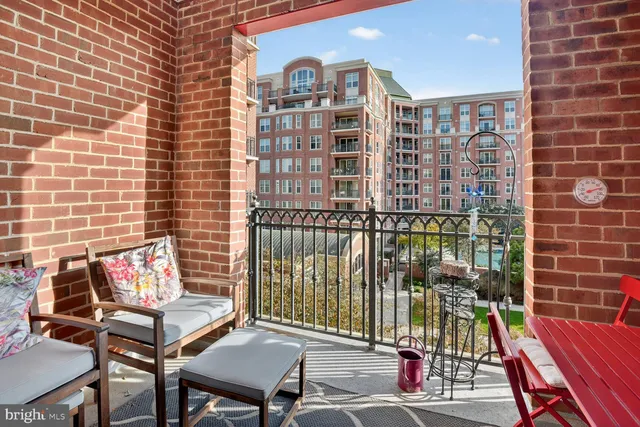 a view of a patio with a table and chairs