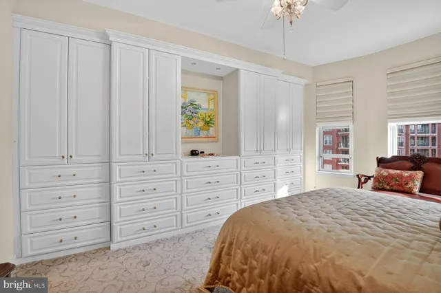 a bedroom with a large bed and a window