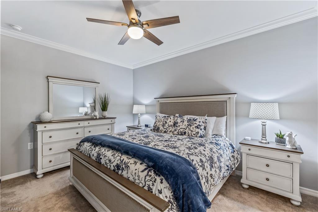 43020 Greenway Boulevard, Unit 332 Babcock Ranch, FL 33982 - Photo 9 of 13 a bedroom with a bed and a dresser