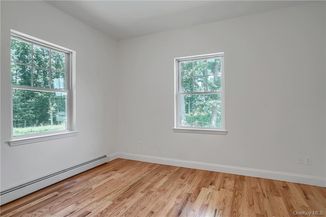 Lot 14-31 Sawyer Way Wallkill, NY 12589 - Photo 16 of 31 a view of an empty room with wooden floor and a window