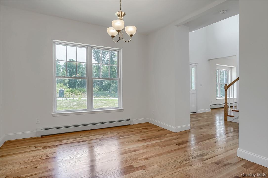 Lot 14-31 Sawyer Way Wallkill, NY 12589 - Photo 17 of 31 a view of an empty room with wooden floor and a window