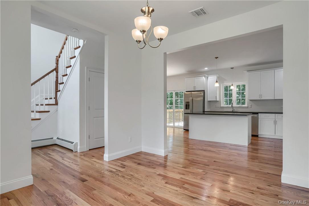 Lot 14-31 Sawyer Way Wallkill, NY 12589 - Photo 18 of 31 a view of kitchen with wooden floor and window