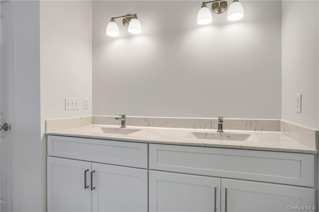 Lot 14-31 Sawyer Way Wallkill, NY 12589 - Photo 28 of 31 a bathroom with a sink and vanity