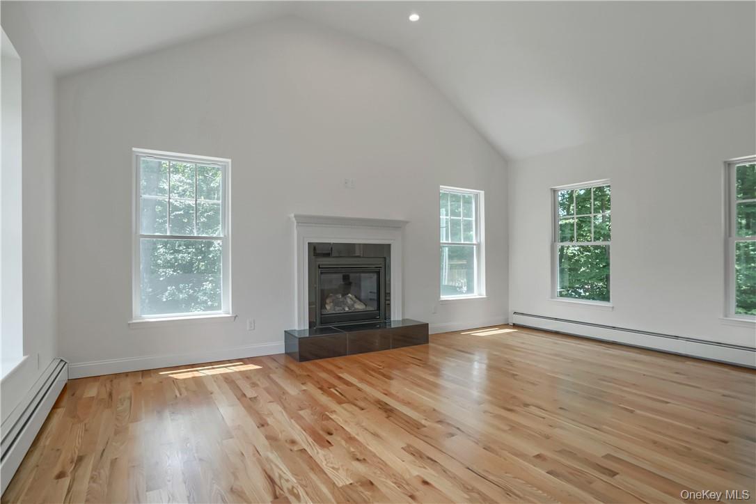 Lot 14-31 Sawyer Way Wallkill, NY 12589 - Photo 4 of 31 an empty room with wooden floor and windows