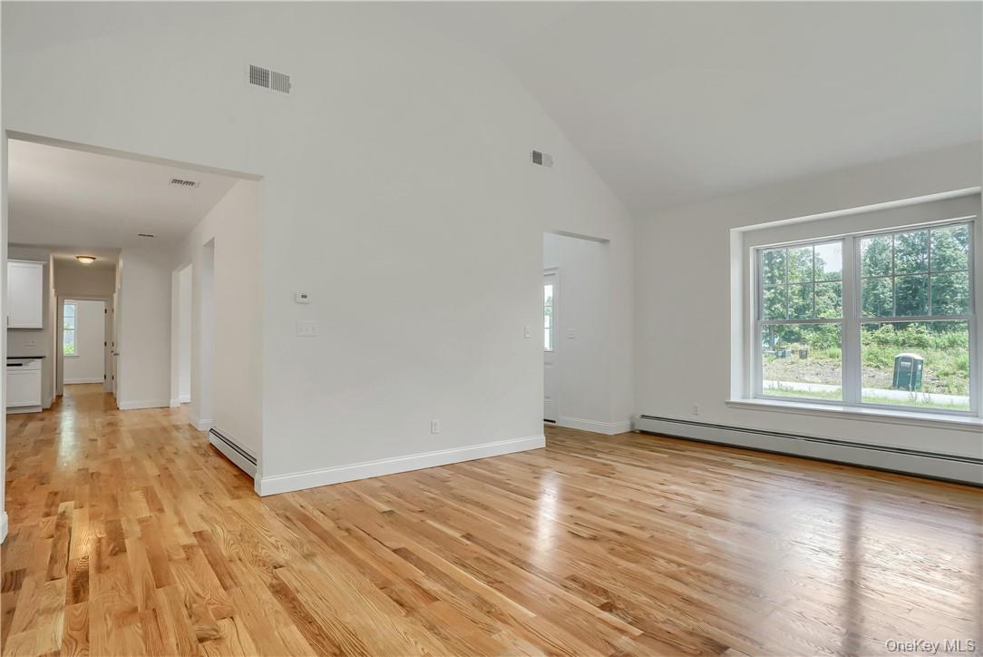 Lot 14-31 Sawyer Way Wallkill, NY 12589 - Photo 6 of 31 a view of an empty room with wooden floor and a window