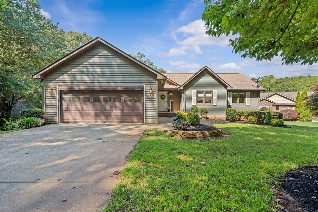 This charming waterfront home has an attached 2 car garage.