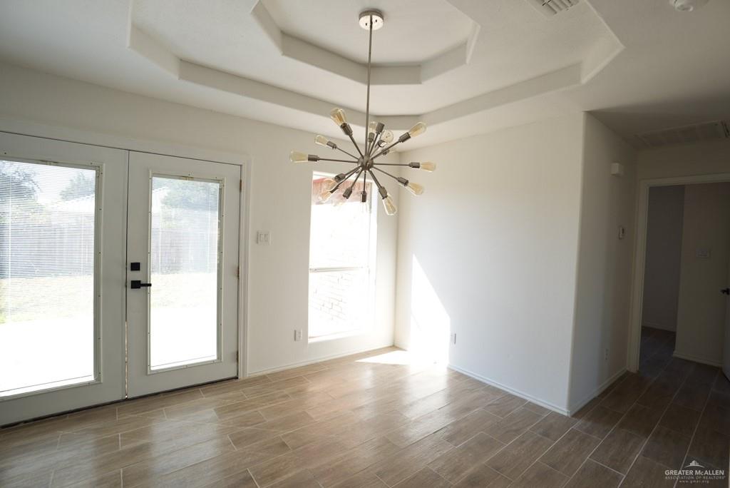 1602 East Rabbit Run Avenue Alton, TX 78573 - Photo 6 of 18 a view of a room with window and wooden floor
