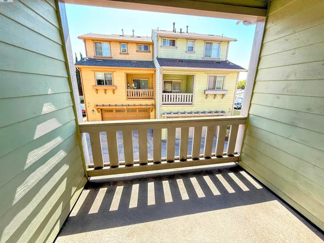 a kitchen with stainless steel appliances granite countertop a refrigerator a sink a stove with wooden cabinets