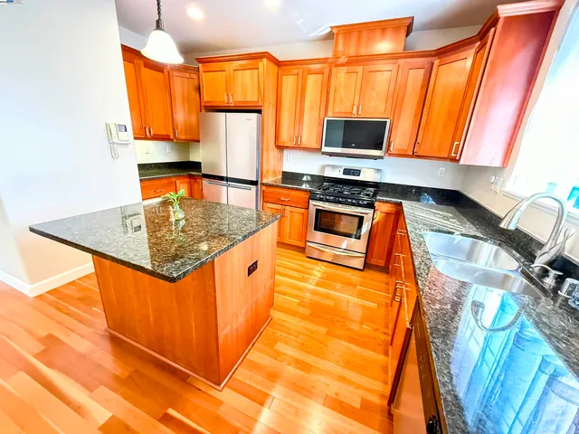 a bathroom with a sink toilet and a mirror