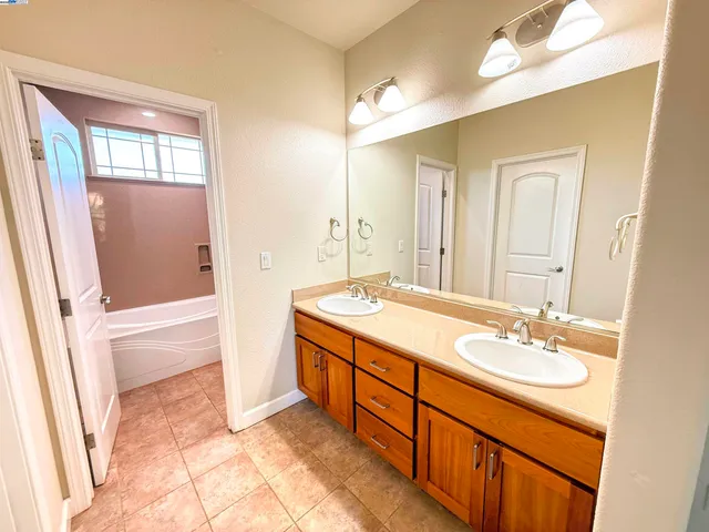 a bathroom with a toilet and a bathtub