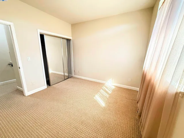 a bathroom with a granite countertop toilet a sink and a bathtub
