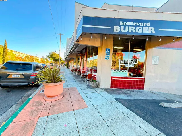 a view of a building with potted plants
