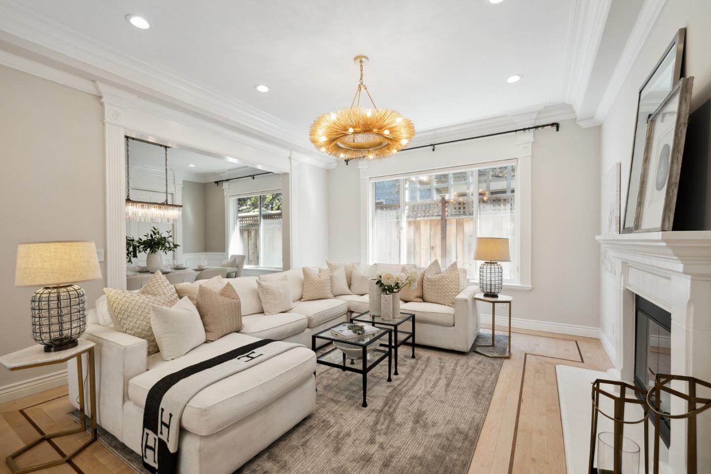 1330 Benito Avenue Burlingame, CA 94010 - Photo 12 of 60 a living room with furniture a fireplace and a chandelier