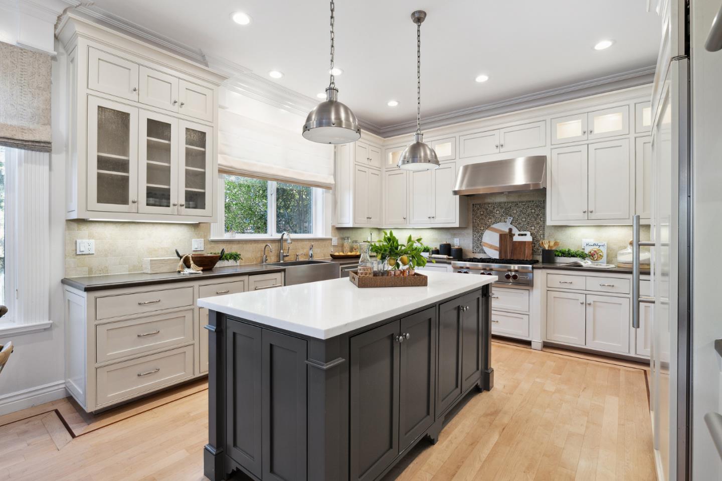 1330 Benito Avenue Burlingame, CA 94010 - Photo 30 of 60 a kitchen with kitchen island granite countertop a sink a center island and cabinets