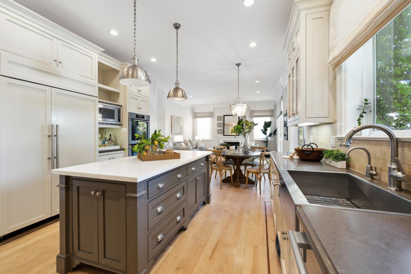 1330 Benito Avenue Burlingame, CA 94010 - Photo 33 of 60 a kitchen with kitchen island a large counter top space a sink stainless steel appliances and windows
