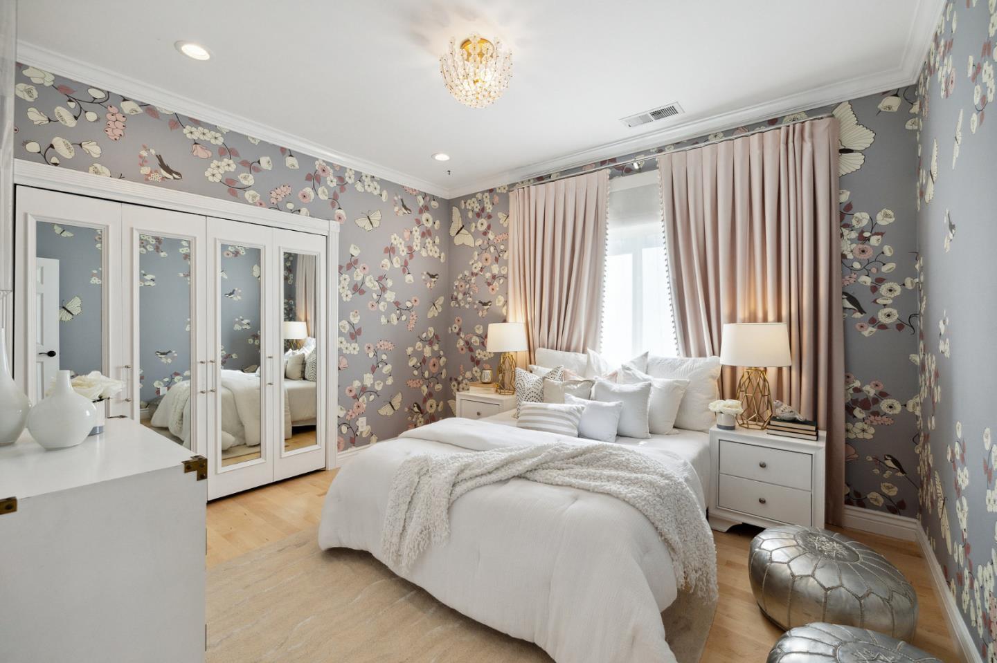 1330 Benito Avenue Burlingame, CA 94010 - Photo 42 of 60 a spacious bedroom with a large bed and a chandelier