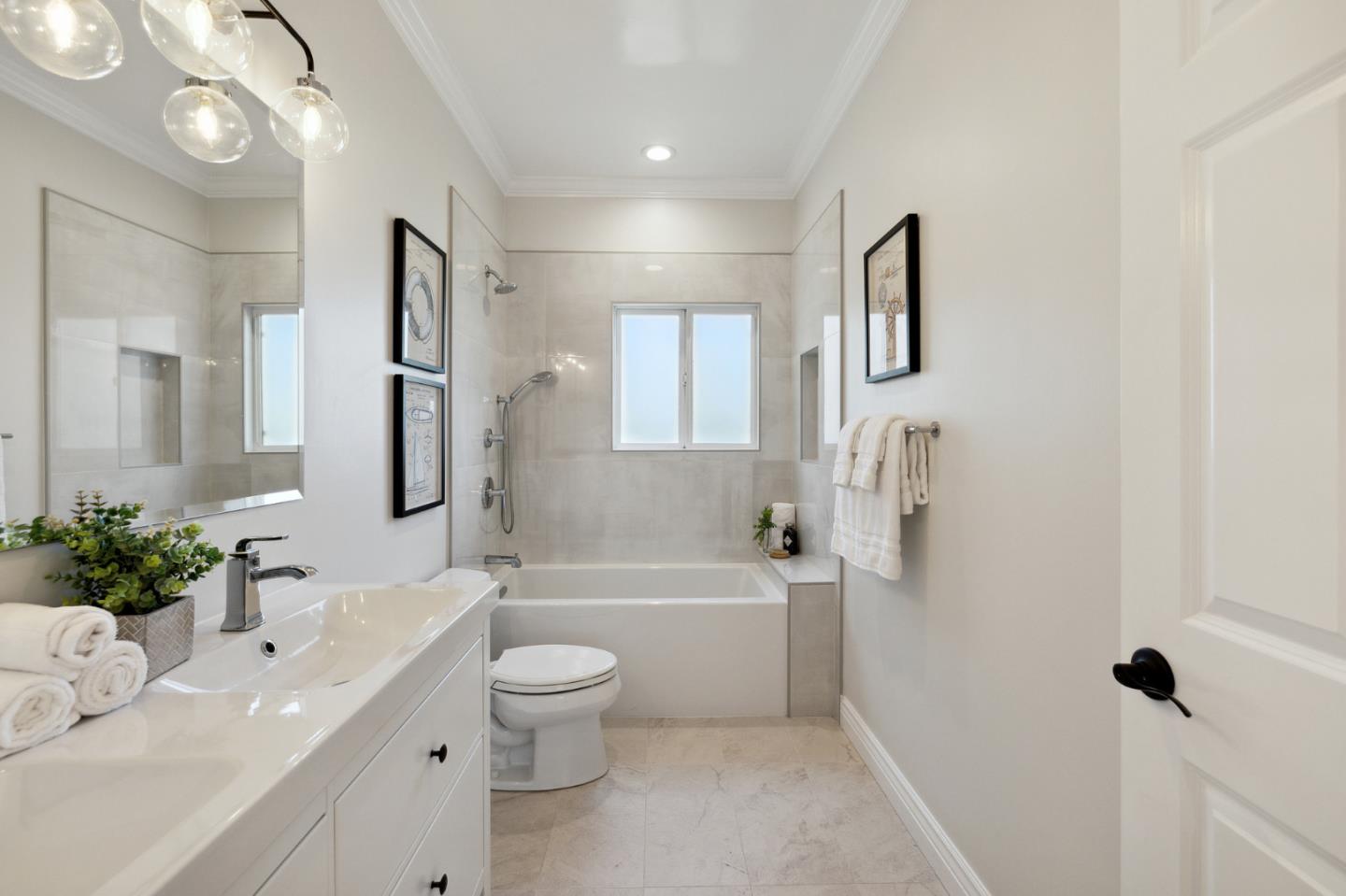 1330 Benito Avenue Burlingame, CA 94010 - Photo 50 of 60 a bathroom with a toilet a sink a tub and a mirror