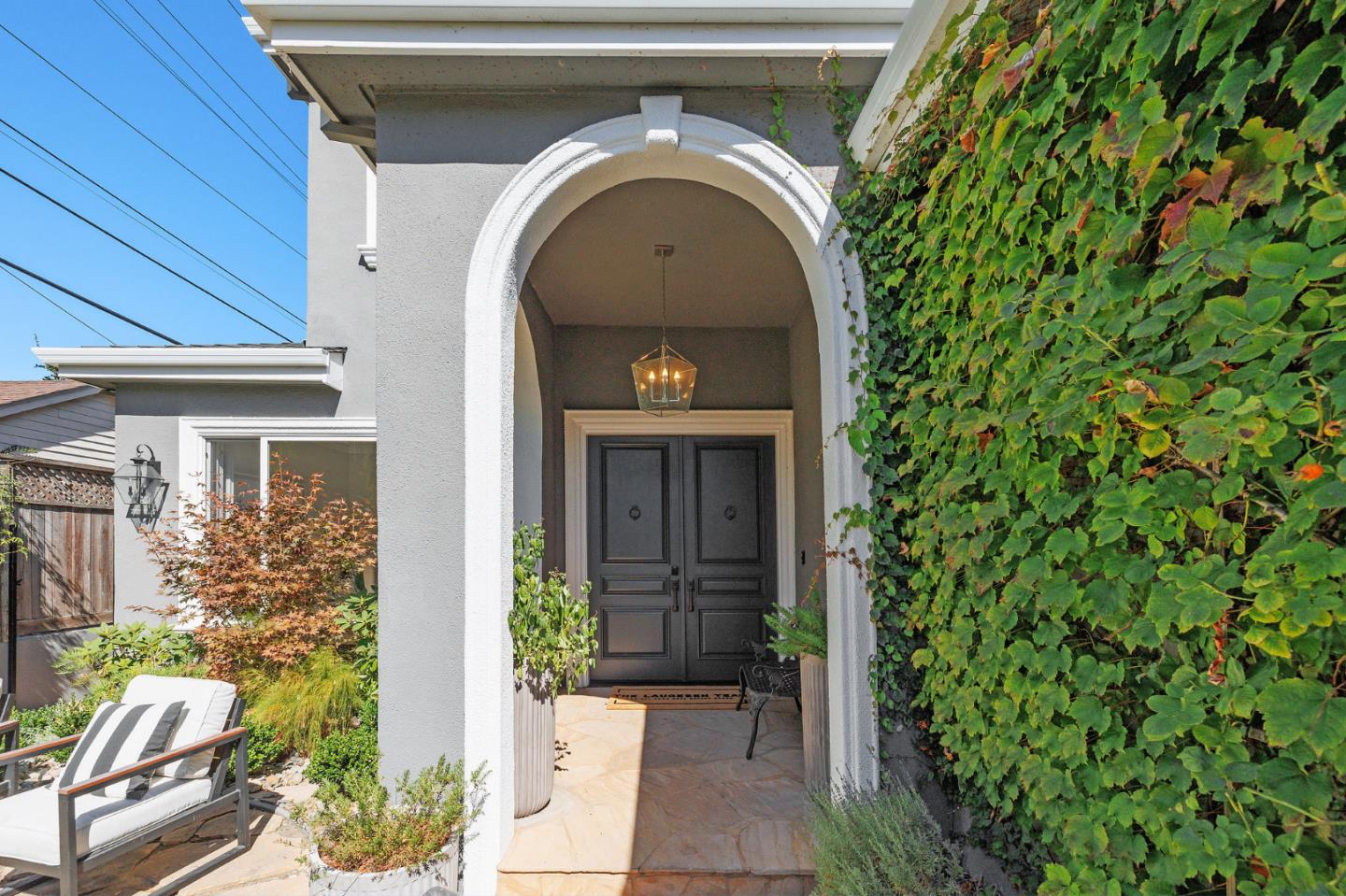 1330 Benito Avenue Burlingame, CA 94010 - Photo 6 of 60 a front view of a house with a garden