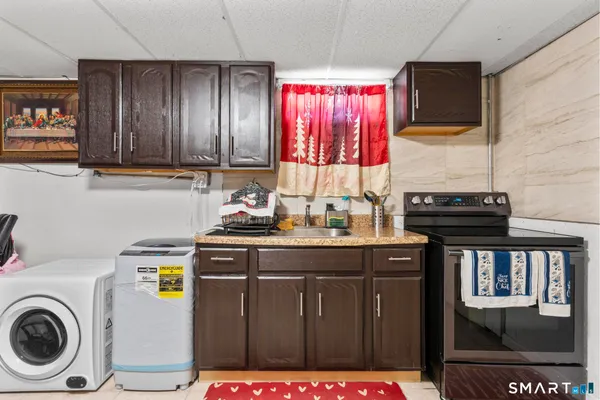 a kitchen that has a lot of cabinets in it