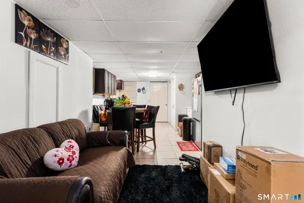a bathroom with a sink a toilet and a shower curtain