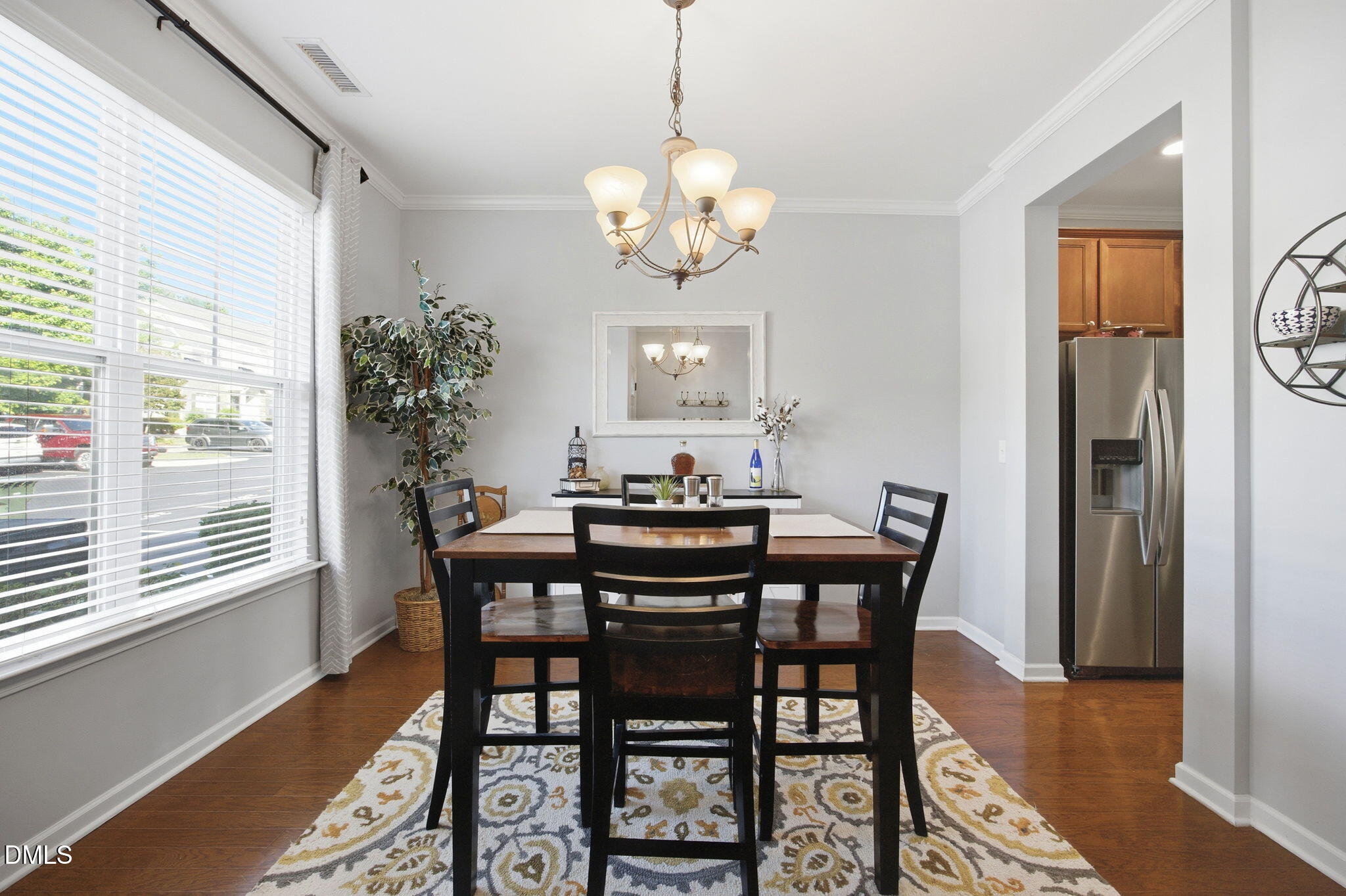 2827 Corbett Grove Drive Raleigh, NC 27616 - Photo 10 of 49 a view of a dining room with furniture window and wooden floor