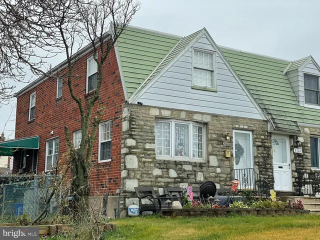 a view of a house with swimming pool and a fire pit