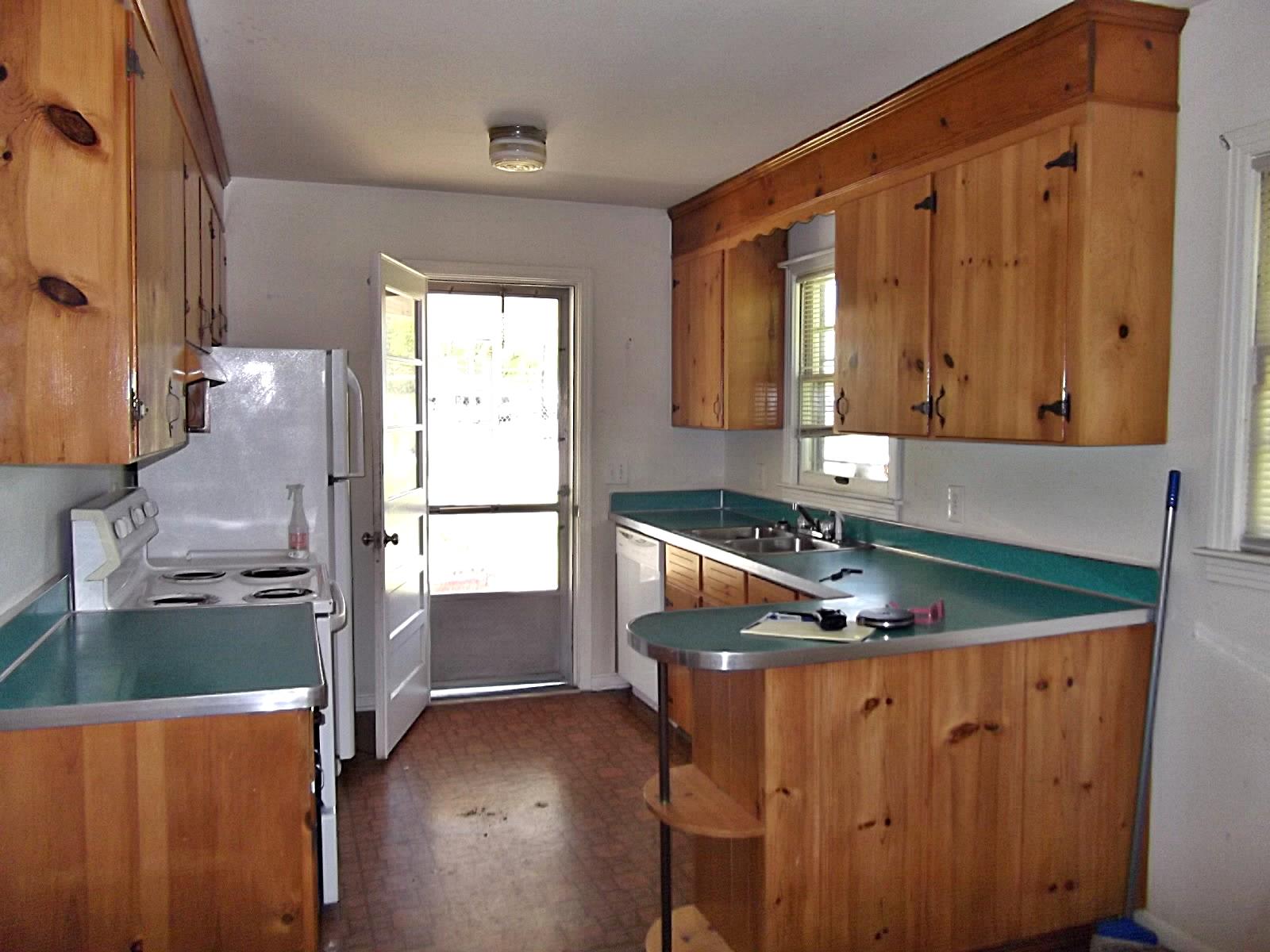 103 Pitt Lane Springfield, TN 37172 - Photo 2 of 15 a kitchen with wooden cabinets and a sink