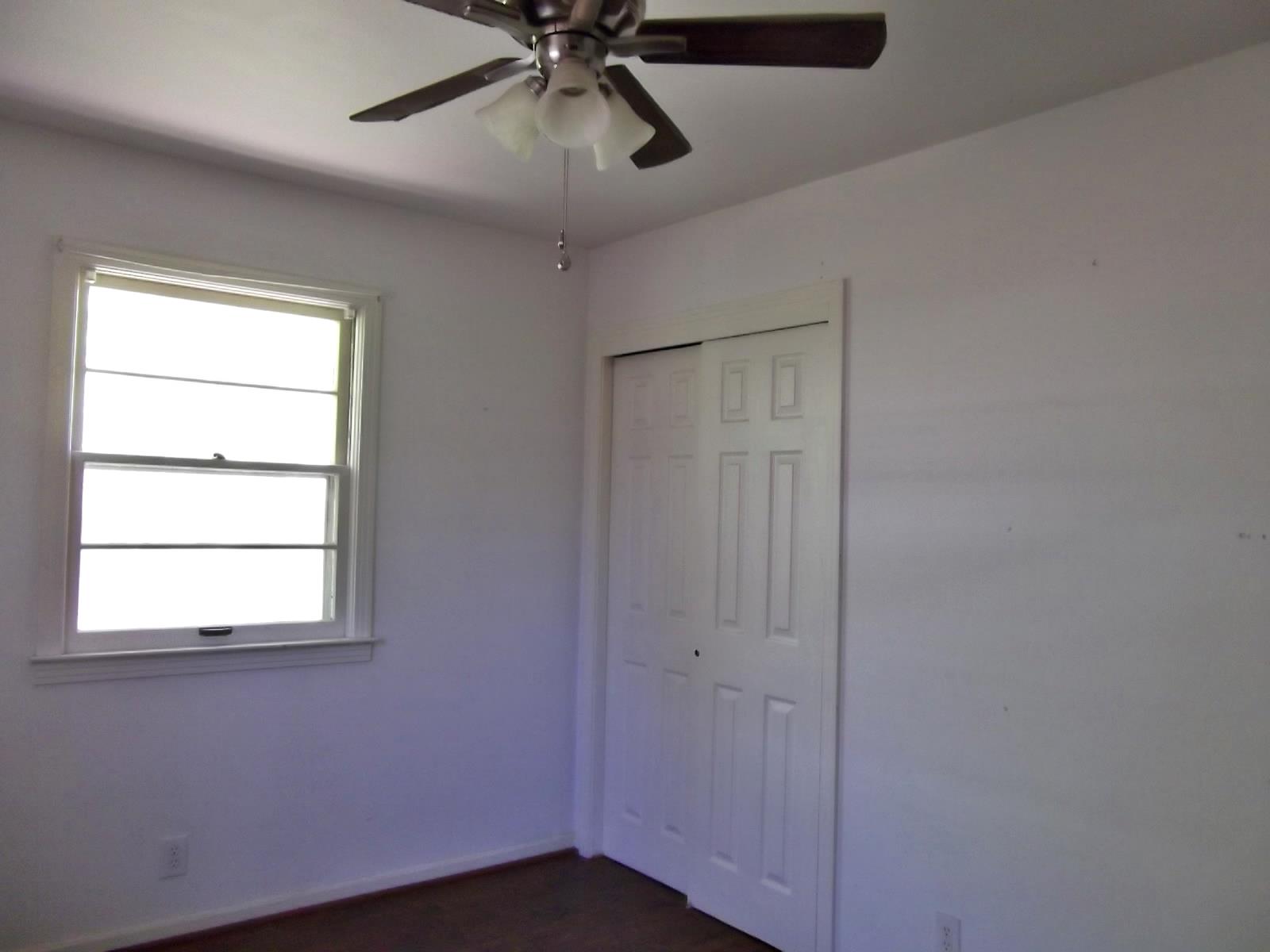 103 Pitt Lane Springfield, TN 37172 - Photo 9 of 15 an empty room with a window and a fan